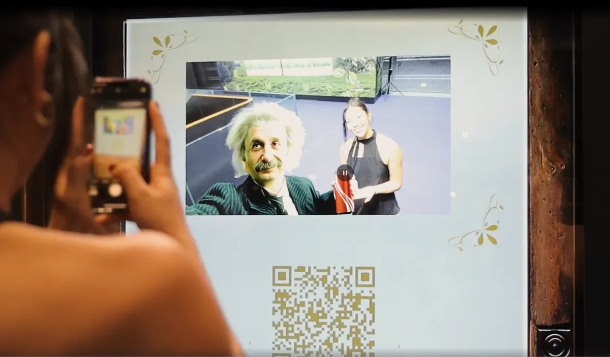 The selfie lands on screen — a QR code takes it home