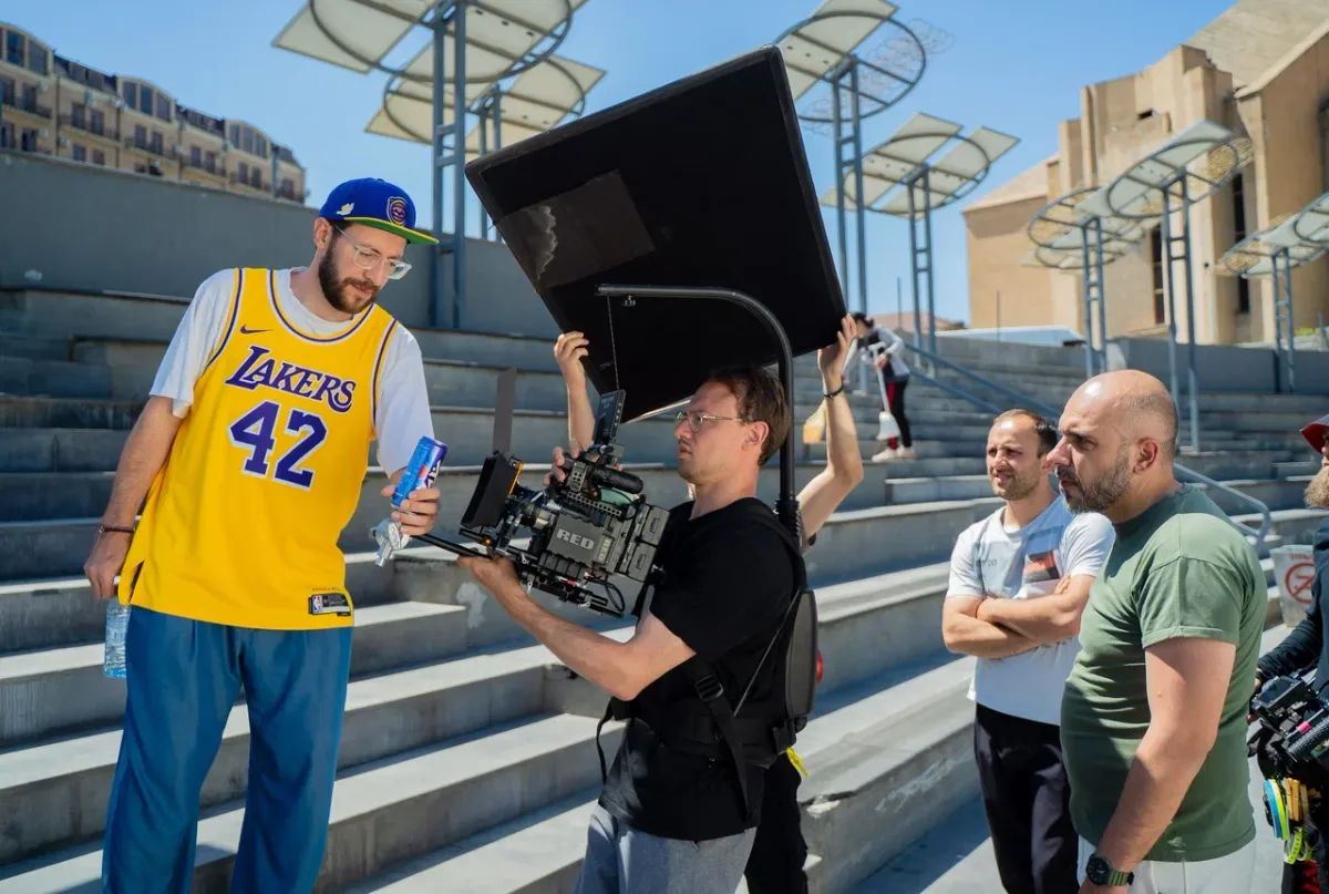 Checking the product with the camera operator on the stairs